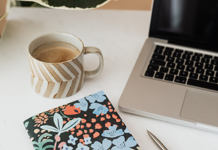 Why is SEO important - desk with coffee, laptop and book